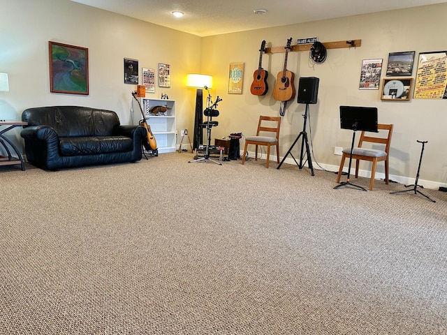 workout room featuring carpet floors and baseboards