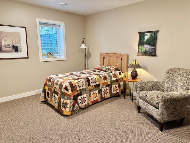 bedroom with carpet flooring and baseboards