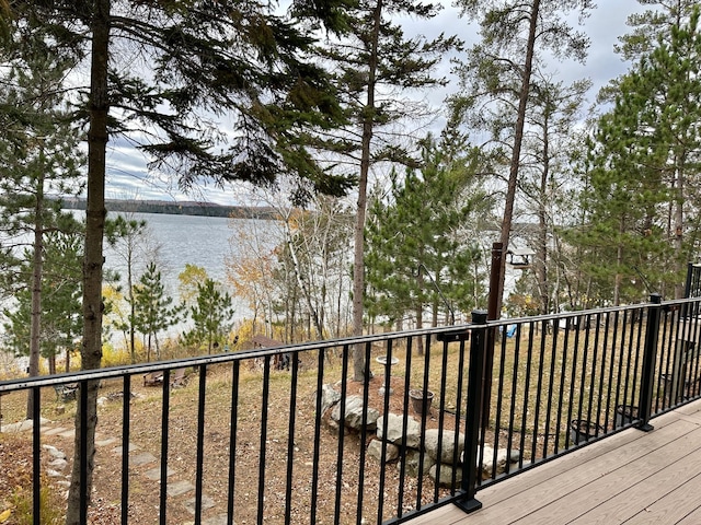 wooden terrace with a water view