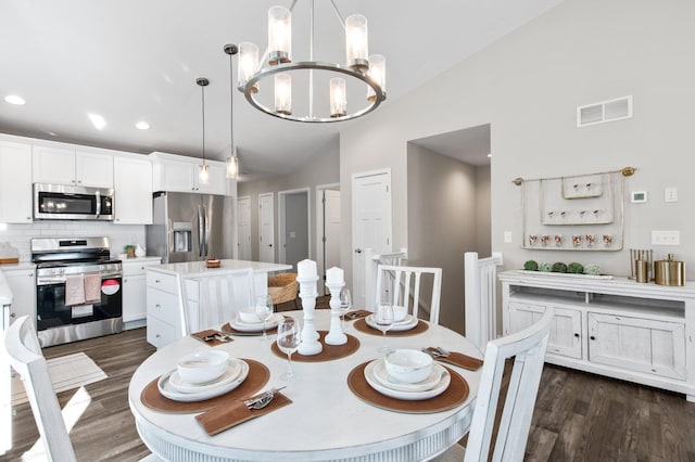 dining space featuring dark wood-style floors, visible vents, recessed lighting, vaulted ceiling, and a notable chandelier