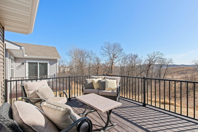 wooden deck with an outdoor living space