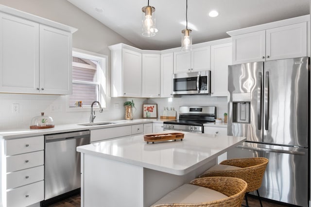 1125 Hewitt Blvd, Red Wing, MN 55066 - kitchen with stainless steel appliances, a sink, light countertops, backsplash, and white cabinets