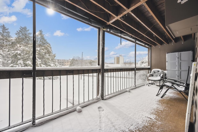 unfurnished sunroom featuring a healthy amount of sunlight