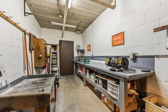 kitchen with concrete floors and concrete block wall