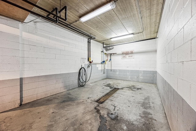 garage with concrete block wall