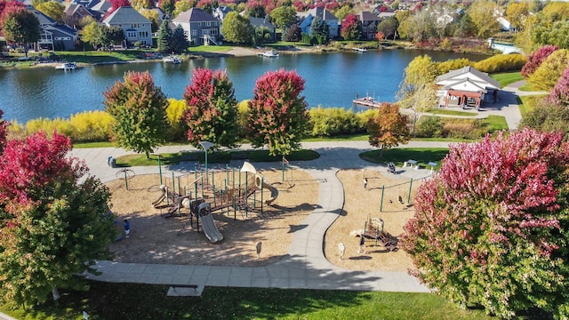 birds eye view of property featuring a water view and a residential view