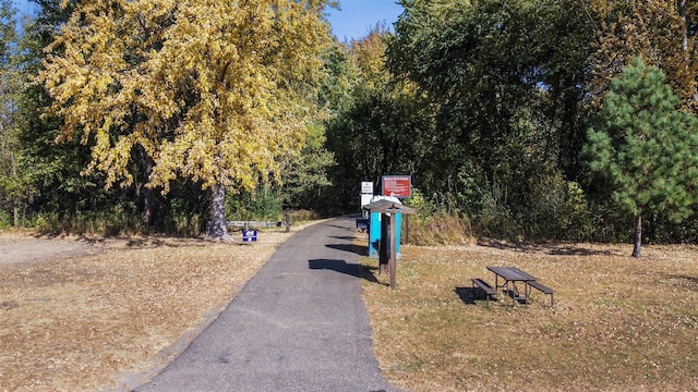 view of street featuring a forest view