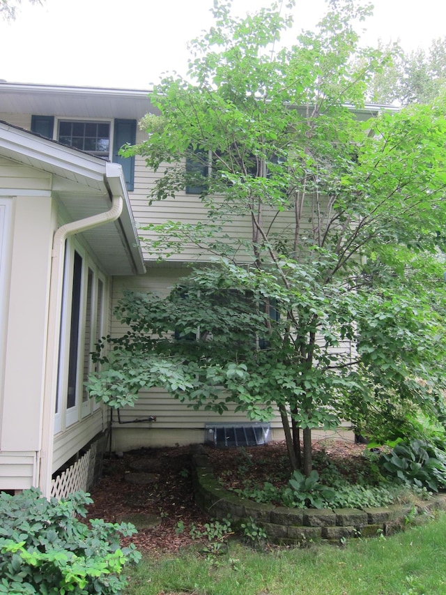 view of home's exterior with central AC unit