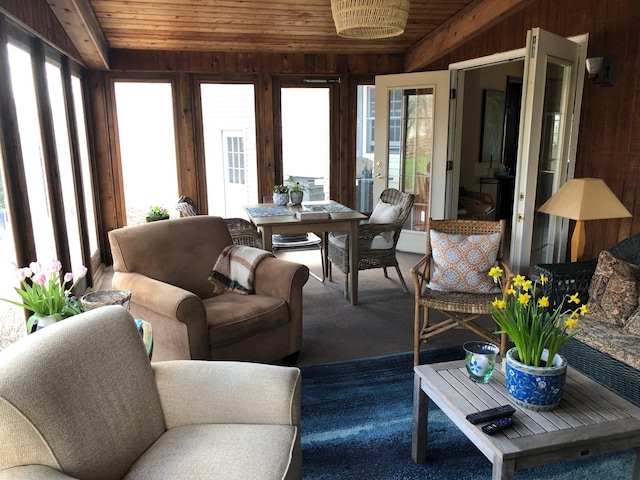 sunroom / solarium with lofted ceiling and wooden ceiling