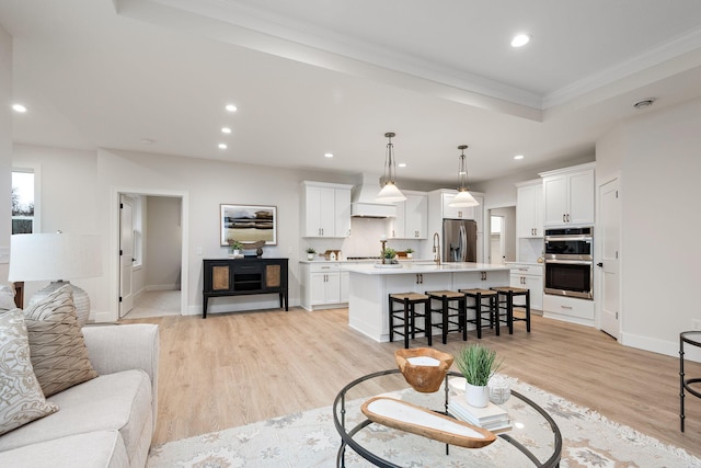 living room featuring recessed lighting and light wood-style flooring