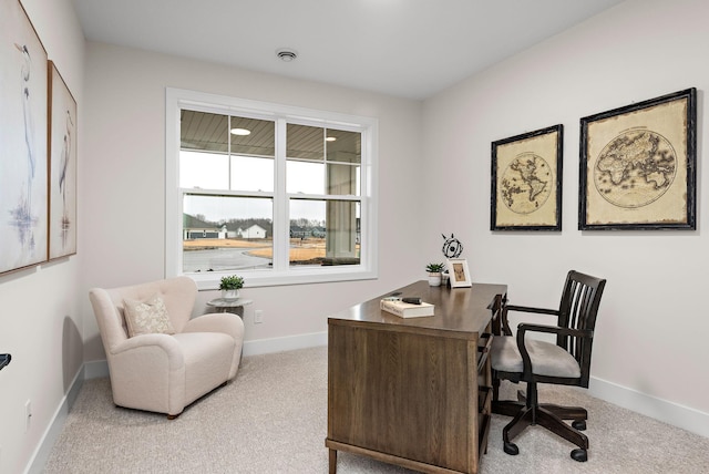 carpeted home office with visible vents and baseboards