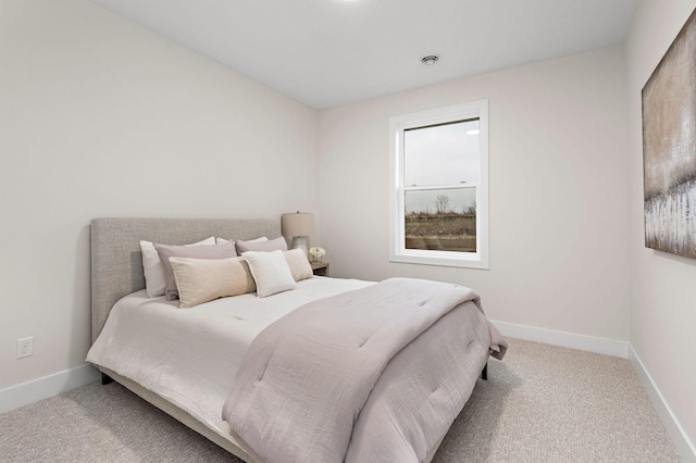 carpeted bedroom with baseboards