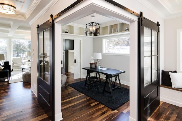 office area with dark wood-style floors, a notable chandelier, a barn door, ornamental molding, and coffered ceiling