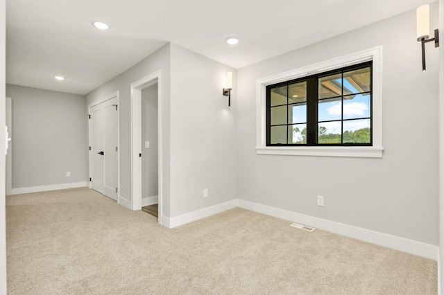 unfurnished room featuring carpet floors, recessed lighting, and baseboards