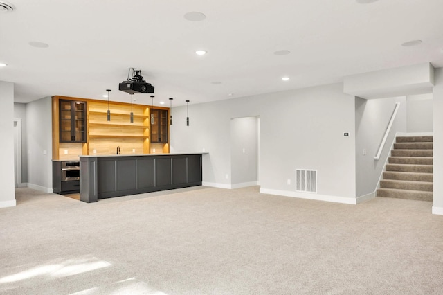 bar with recessed lighting, light carpet, visible vents, stairway, and indoor wet bar