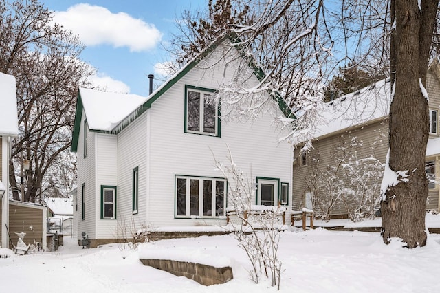 view of snow covered house