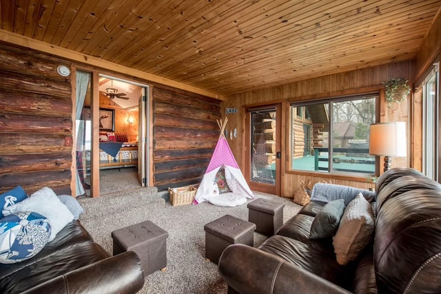 carpeted living room featuring wooden ceiling and wooden walls