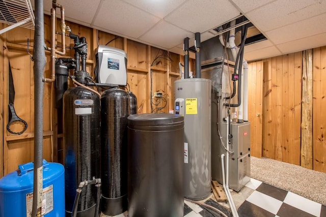 utility room with water heater and heating unit