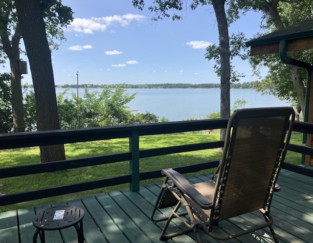 wooden terrace with a water view