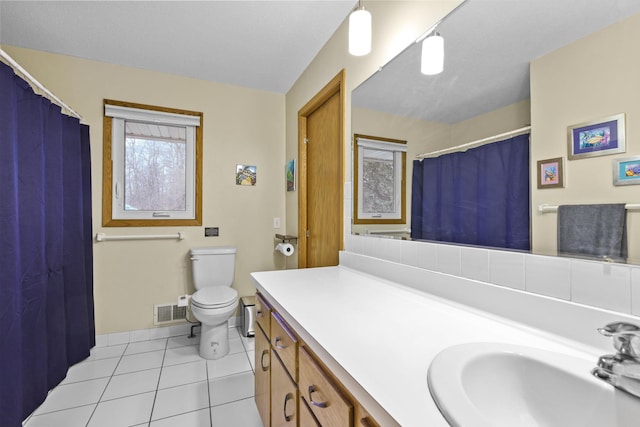 bathroom featuring vanity, visible vents, curtained shower, tile patterned floors, and toilet