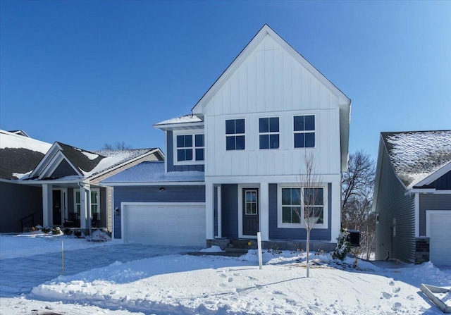 view of front of home featuring board and batten siding and a garage