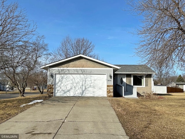 single story home featuring driveway, stone siding, fence, an attached garage, and a shingled roof