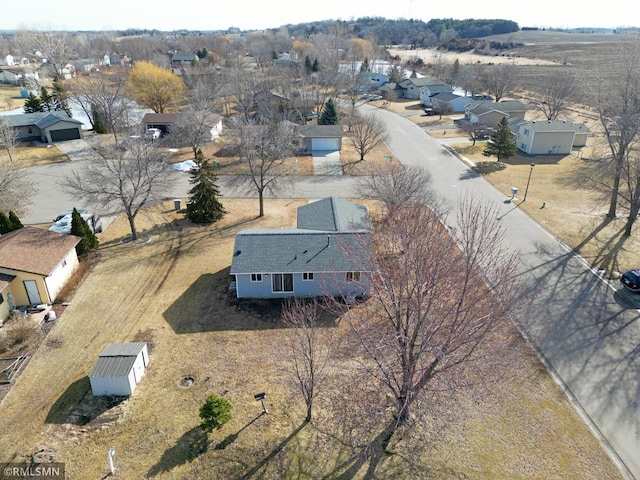 birds eye view of property with a residential view