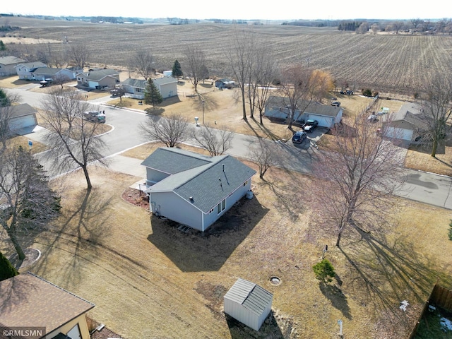 birds eye view of property with a rural view