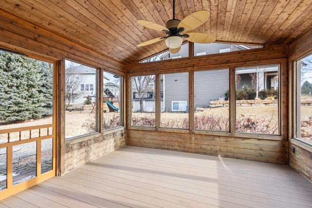 unfurnished sunroom with ceiling fan, lofted ceiling, and wooden ceiling