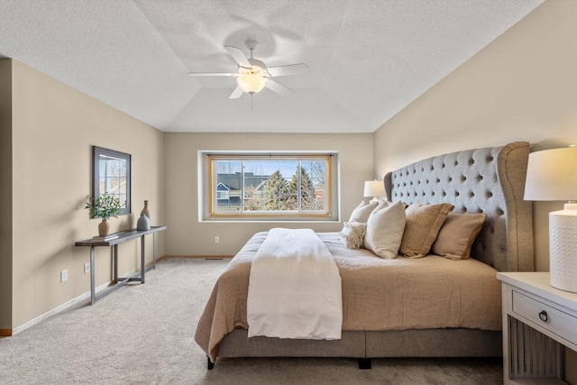 bedroom with baseboards, multiple windows, light colored carpet, and lofted ceiling