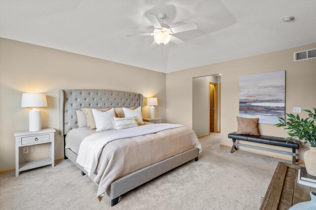 bedroom with light carpet, visible vents, a ceiling fan, and baseboards