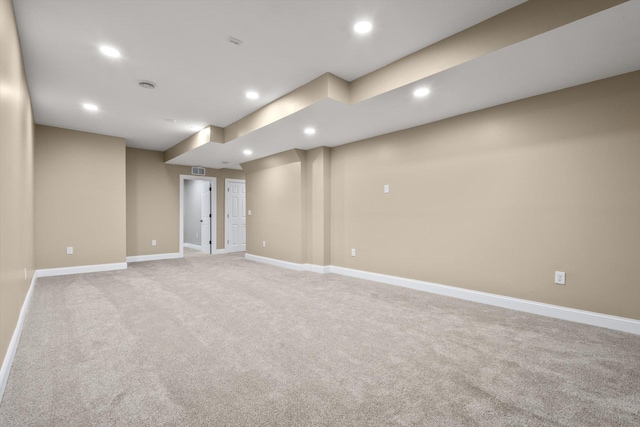 unfurnished room with light colored carpet, visible vents, recessed lighting, and baseboards