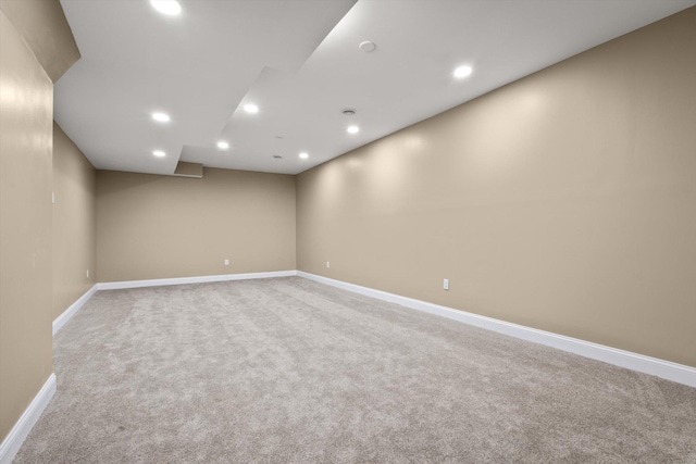 empty room with recessed lighting, baseboards, and carpet flooring