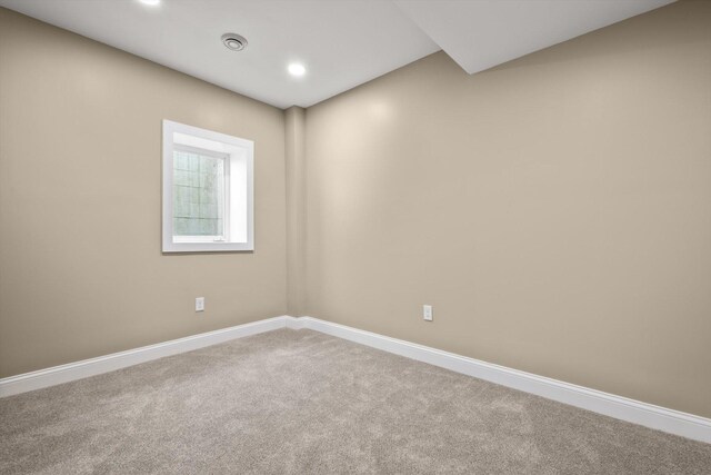 unfurnished room with recessed lighting, baseboards, and carpet