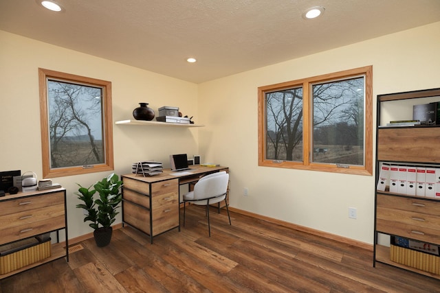 home office featuring a healthy amount of sunlight, baseboards, dark wood finished floors, and recessed lighting