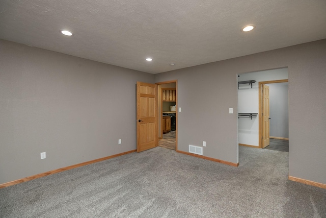 unfurnished bedroom featuring baseboards, visible vents, and recessed lighting