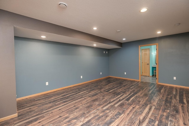 below grade area with recessed lighting, baseboards, and wood finished floors