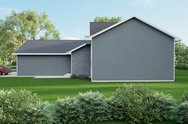 view of home's exterior featuring a yard and a shingled roof