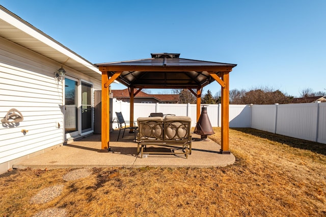 view of patio with a gazebo and a fenced backyard