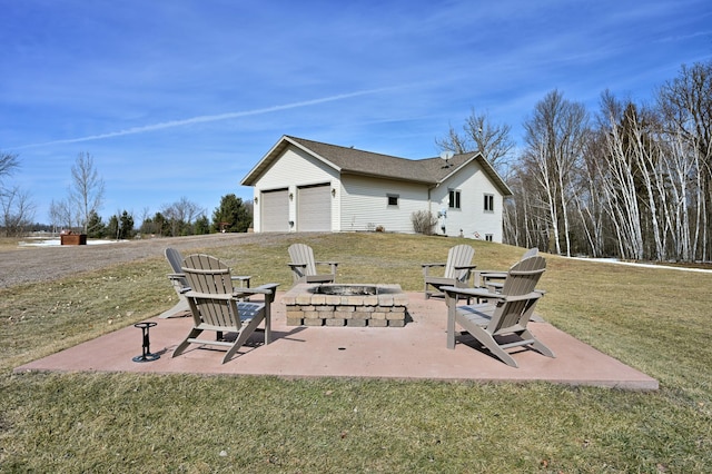 view of patio with a fire pit and an attached garage