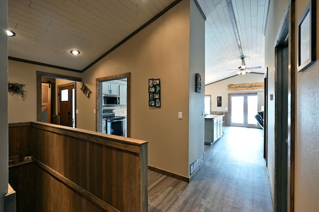 interior space with wooden ceiling, vaulted ceiling, and wood finished floors