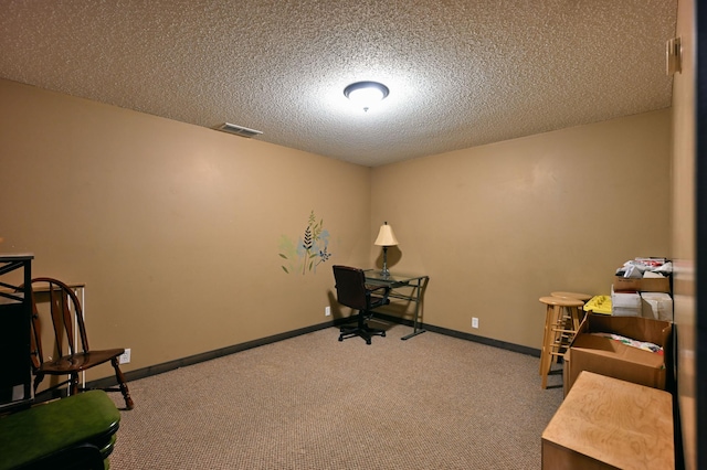 office space with carpet, visible vents, a textured ceiling, and baseboards