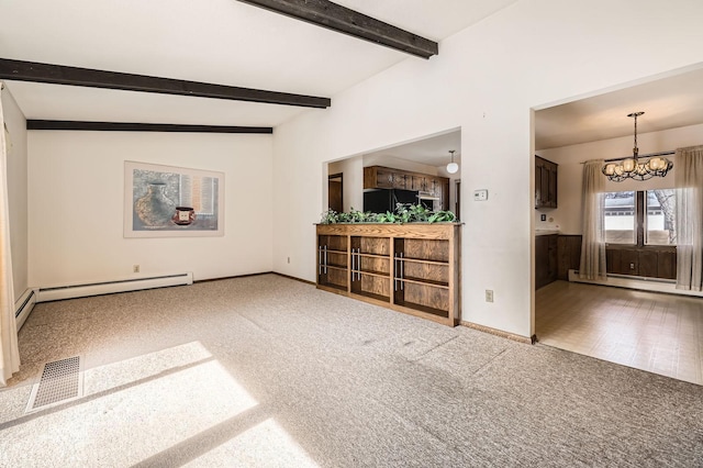 unfurnished living room with a notable chandelier, visible vents, baseboards, and carpet floors