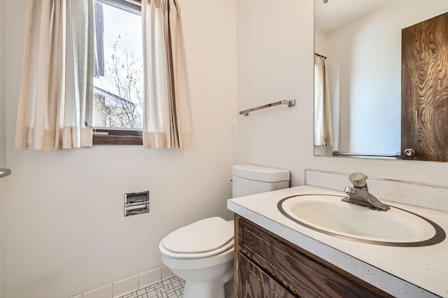 bathroom with toilet and vanity