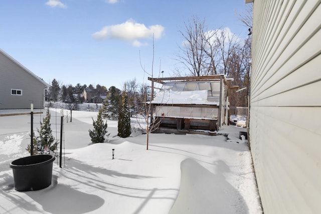 view of yard layered in snow