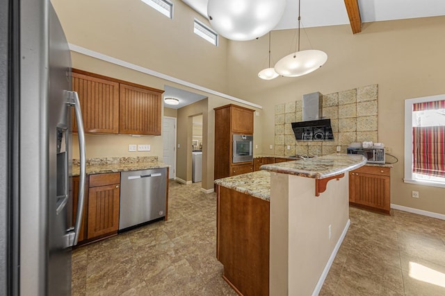 kitchen featuring light stone counters, a breakfast bar area, baseboards, appliances with stainless steel finishes, and brown cabinets