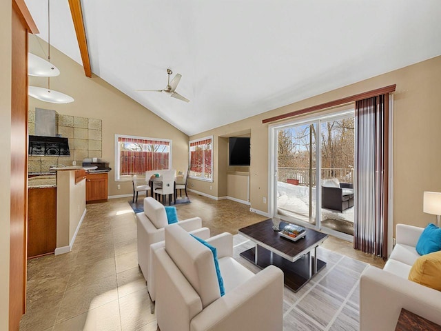 living room with a ceiling fan, high vaulted ceiling, baseboards, and light tile patterned floors