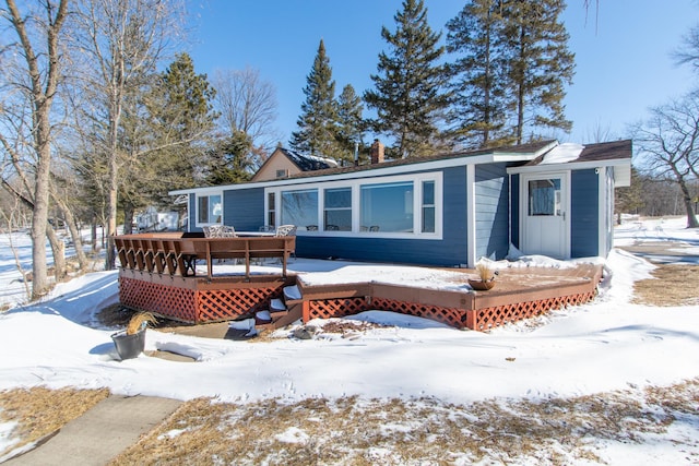 view of front of home featuring a wooden deck