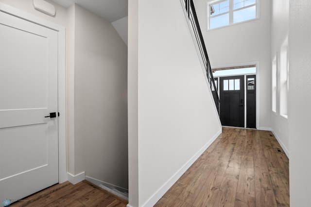 interior space with hardwood / wood-style flooring and baseboards