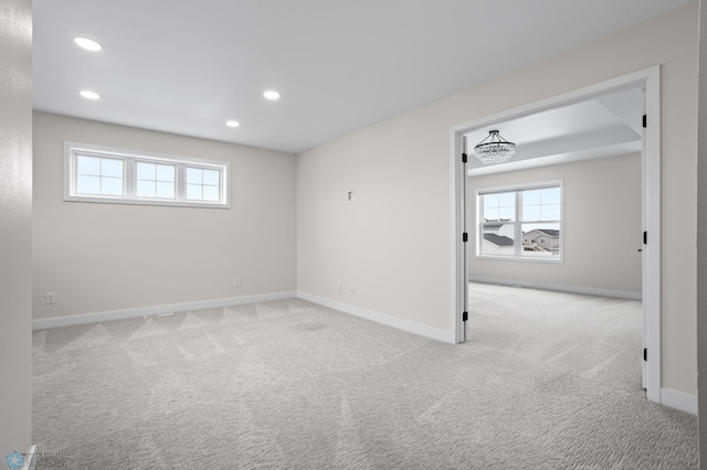 carpeted spare room with baseboards and recessed lighting